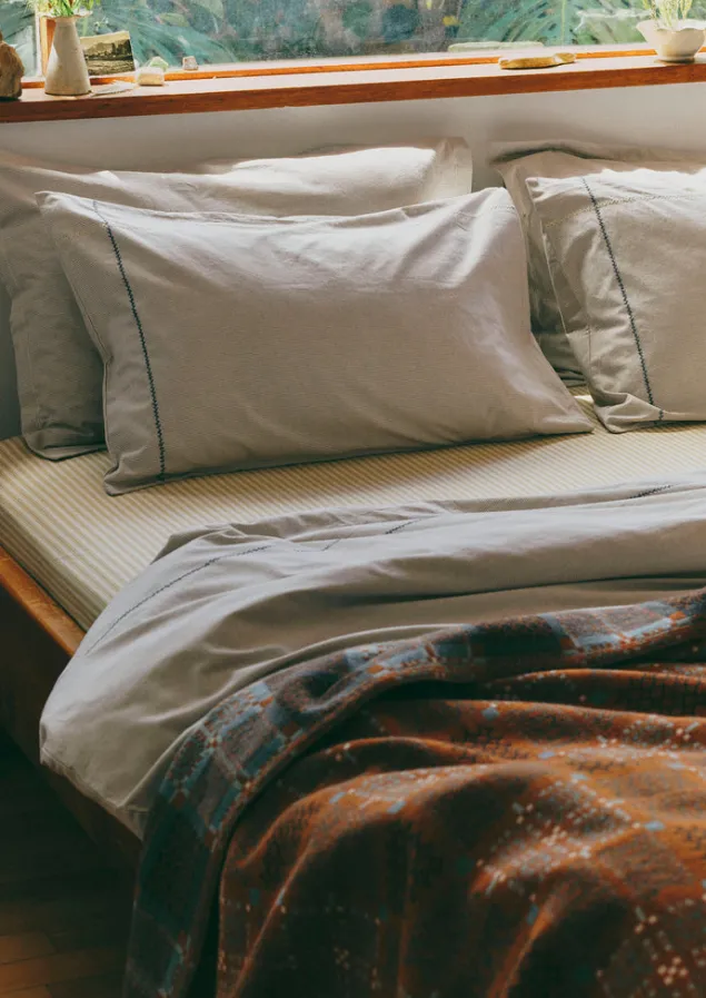 fine_stripe_organic_cotton_oxford_pillowcase_set_4.webp Textiles | Bed Linen-TOAST Fine Stripe Organic Cotton Oxford Pillowcase Set Ecru/SmokeBlue